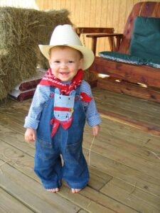 child in cowboy hat